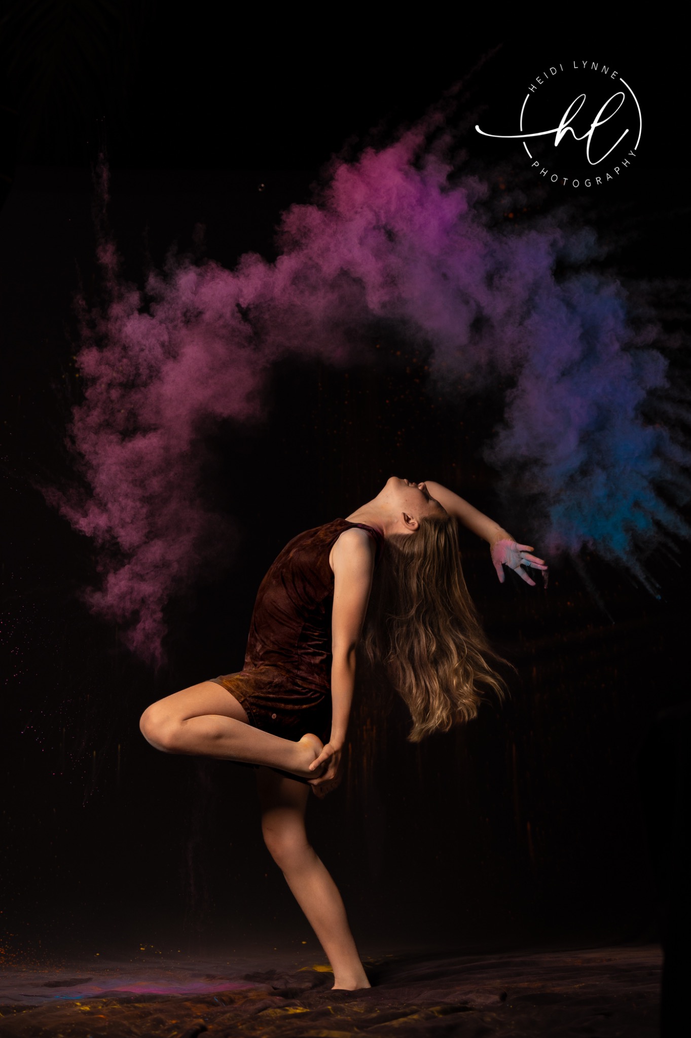 Athlete portrait with vibrant chalk powder effects creating bold dynamic visual for youth sports photography session