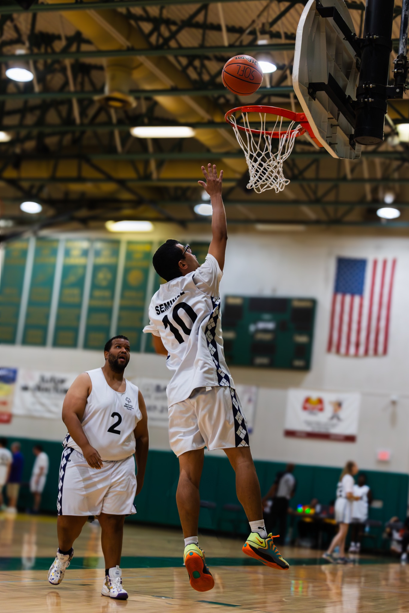 Youth basketball player layup in competitive game — Volusia County sports photography — Heidi Lynne Photography